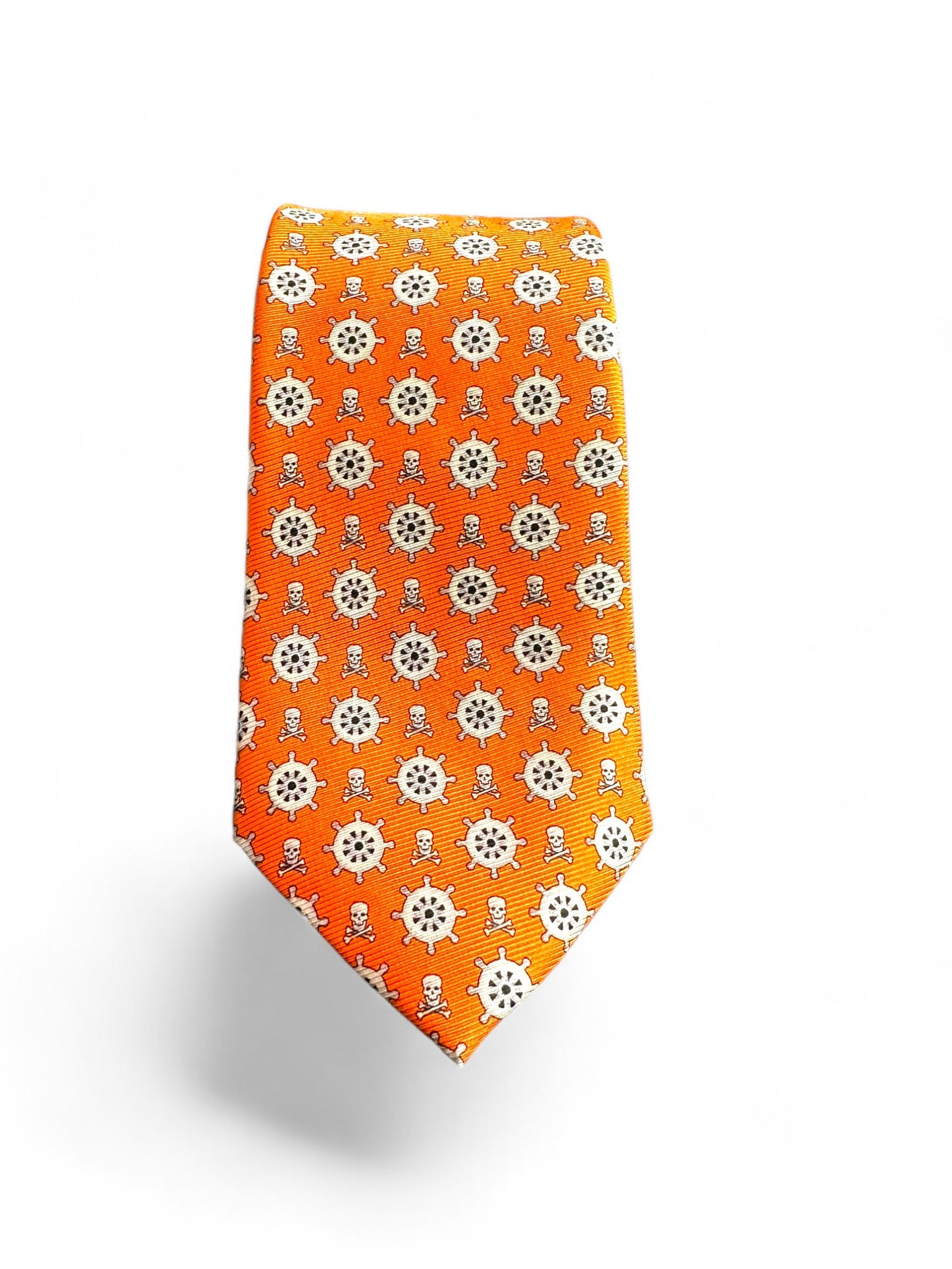 The SUITCAFE Silk Twill Tie in Tangerine Orange & Grey, featuring a sophisticated ship's wheel sailor theme. Crafted from luxurious silk twill, this 100% handmade necktie adds a touch of elegance to any ensemble. Make a statement and set sail with this unique and stylish accessory.
