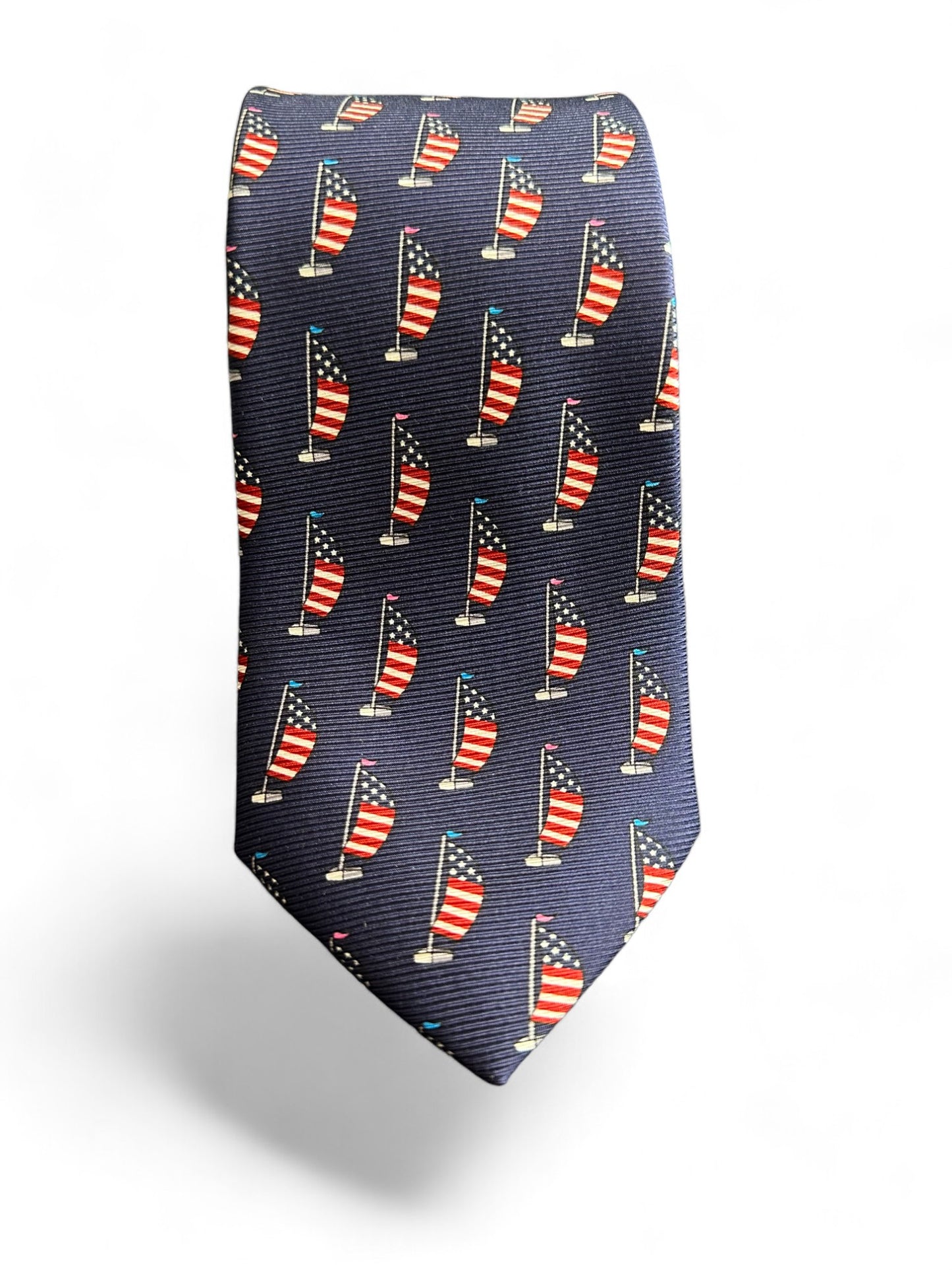 Our SUITCAFE Patriot tie. Handmade from luxurious silk twill, this geometric tie proudly features the iconic USA flag and sail boat design. Truly an exclusive addition to your wardrobe. Perfect for the sophisticated and patriotic gentleman.