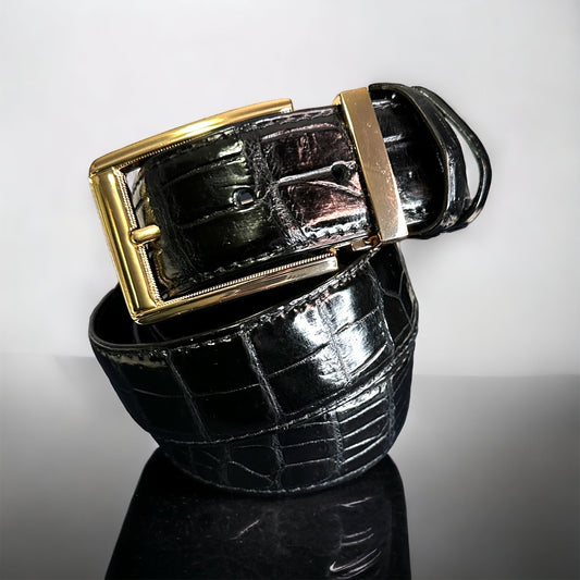 This handmade black natural skin belt in crocodile serves as the standard for men's belts for suits. What is so great about this type of skin is that it fits with any outfit even jeans. With the supplied gold square and nickel square buckles, you get to choose what look you need for any type of event. Adjustable. Interchangeable buckle.