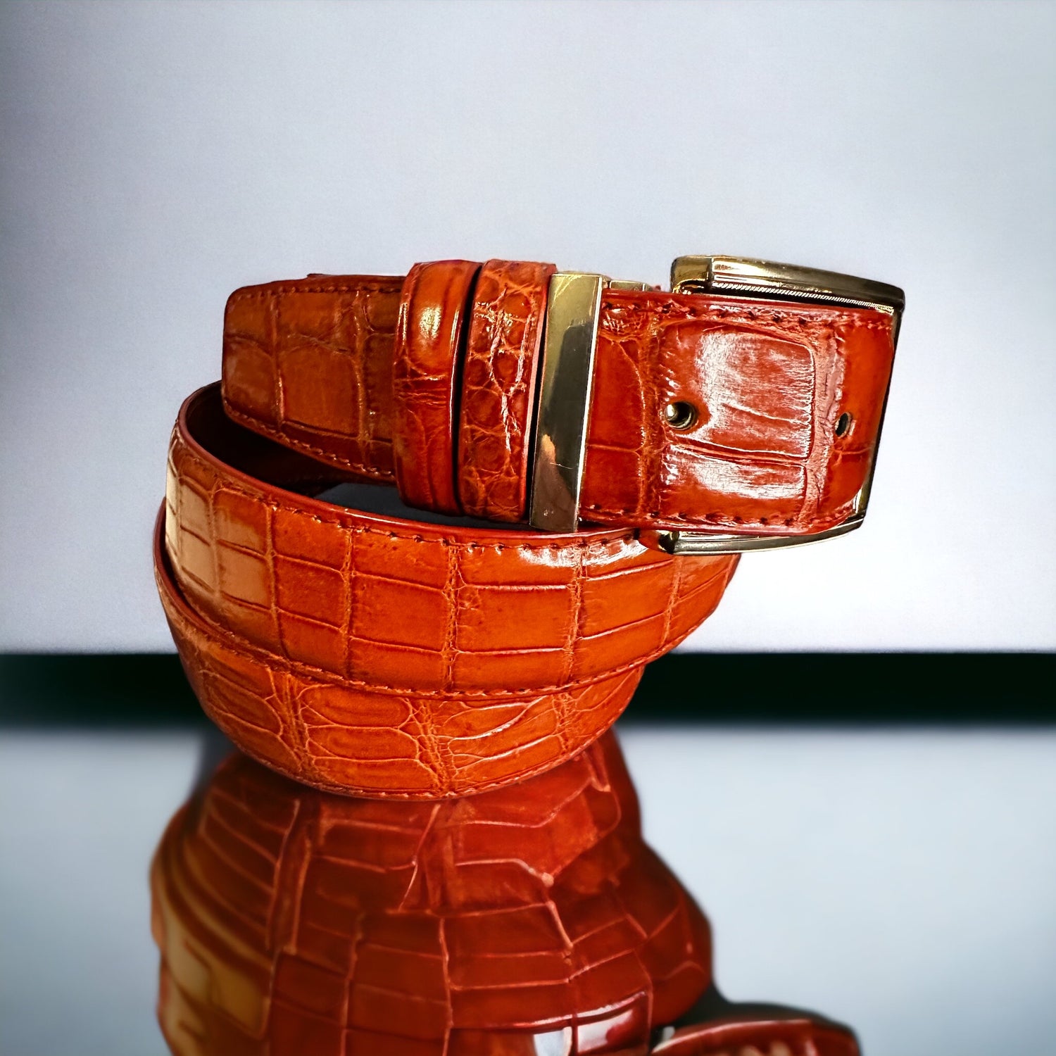This handmade cognac natural skin belt in crocodile serves as the standard for men's belts for suits. What is so great about this type of skin is that it fits with any outfit even jeans. With the supplied gold square and nickel square buckles, you get to choose what look you need for any type of event. Adjustable. Interchangeable buckle.