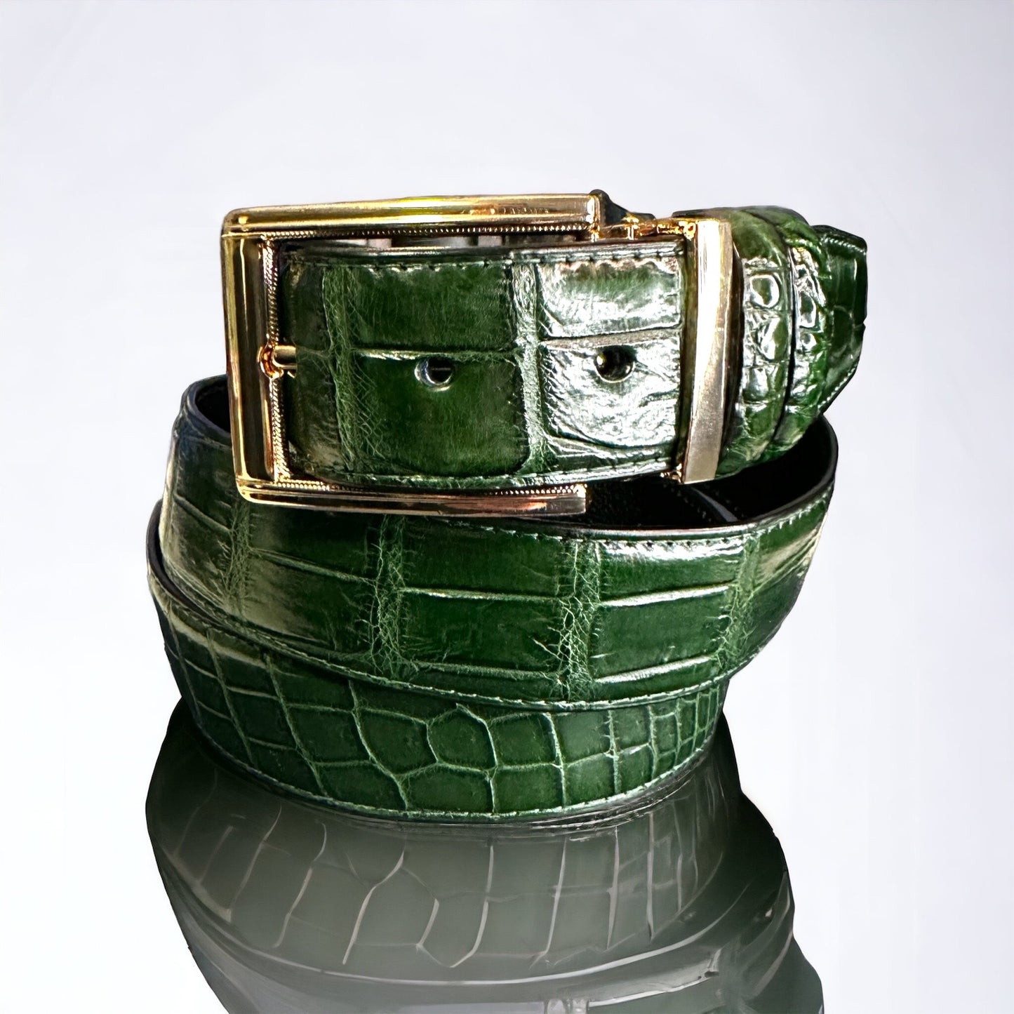 This handmade emerald green natural skin belt in crocodile serves as the standard for men's belts for suits. What is so great about this type of skin is that it fits with any outfit even jeans. With the supplied gold square and nickel square buckles, you get to choose what look you need for any type of event. Adjustable. Interchangeable buckles.