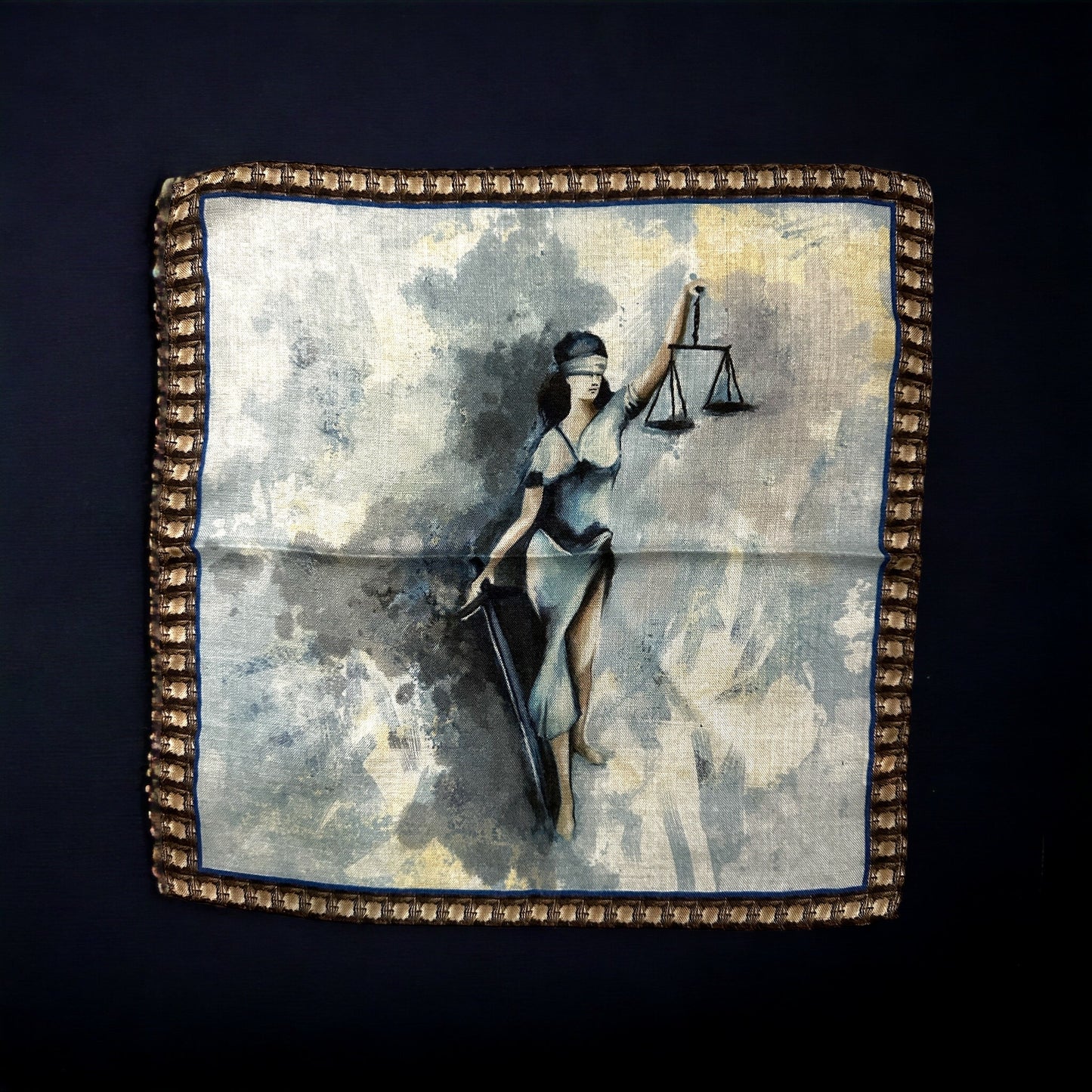 A pocket square perfect for that attorney in your life. Silk with hand rolled edges, Lady Justice is a personification of the moral force that underlies the justice system. The image of Lady Justice is a familiar one, featuring a woman holding a scale in one hand and a sword in the other, while blindfolded. The origins of Lady Justice can be traced back to ancient Greek and Roman mythology, where the goddesses Themis and Justitia respectively represented the concept of justice.