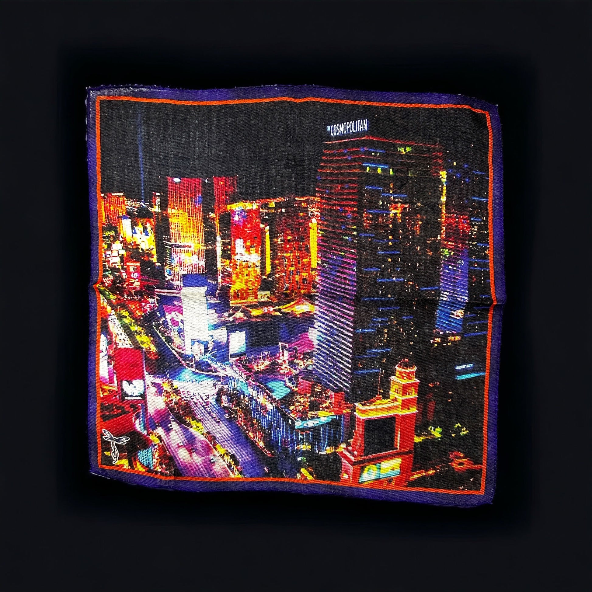 New designs in beautiful and colorful pocket square for your new sport jacket or suit. Adding color and casualness to any outfit these pocket squares depict different exotic cities across the world. Here we have the Las Vegas strip showing the Cosmopolitan Hotel and Casino. Hand rolled edge. Made in Italy. 14 x14 inches.