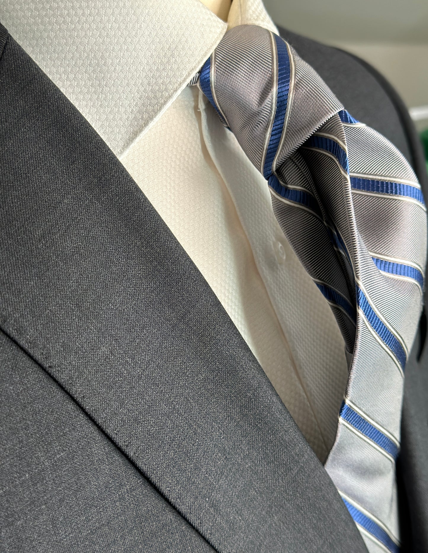 This 100% woven silk tie is a perfect stone grey. Allowing for matching with many colors, the stone grey is very neutral in its base. Added is a touch of french blue stripe. Just enough to bring out the blue in any garment or shirt. 
