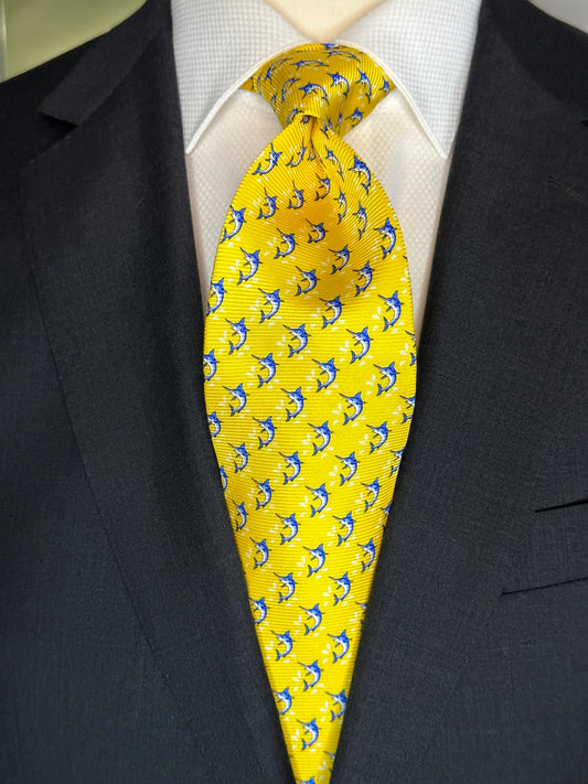 This beautiful 100% silk twill necktie features the swordfish motif with small splashes of water. Being a geometric type pattern, this tie is most interesting because people tend to look twice to realize that the pattern is made up of blue swordfish. Hermes style..